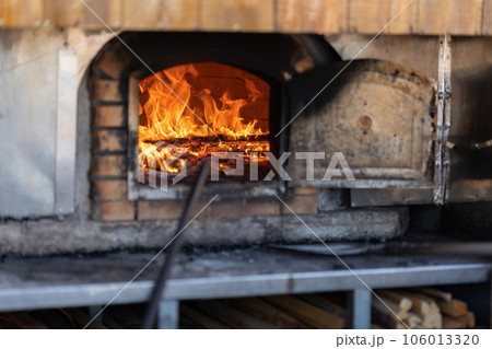 Burning Fire In The Fireplace - outdoors Burning Fire In The Fireplace - outdoors 106013320