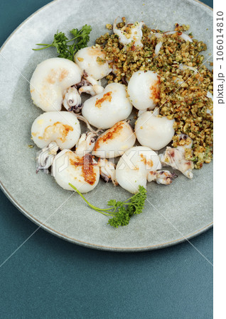 Grilled squids with nuts. Grilled squids with nuts. 106014810