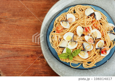 Pasta with fried clams vongole, space for text. Pasta with fried clams vongole, space for text. 106014817