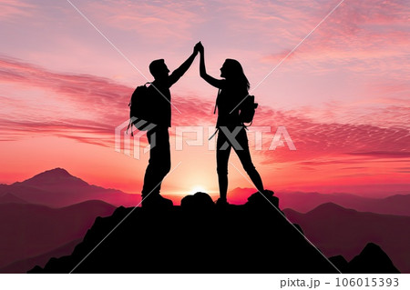 Silhouette of a couple on top of a mountain at sunset Silhouette of a couple on top of a mountain at sunset 106015393