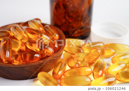 Fish oil or Cod liver oil gel in capsules with omega 3 vitamins, supplementary healthy food 106021246