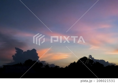 Real amazing panoramic sunrise or sunset sky with gentle colorful clouds. 106021531