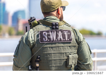 equipped swat soldier standing on a peir 106021687