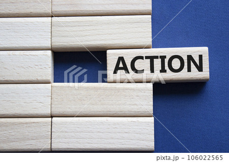 Action symbol. Concept word Action on wooden blocks. Beautiful deep blue background. Business and Action concept. Copy space. 106022565