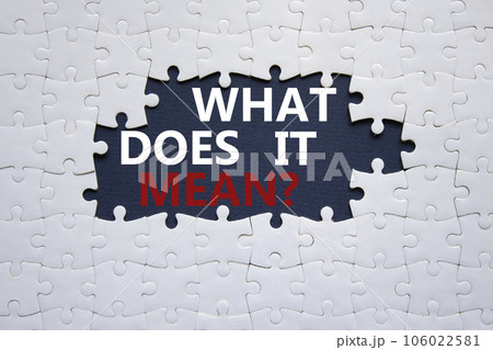 What does it mean symbol. White puzzle with words What does it mean. Beautiful black background. Business and What does it mean concept. Copy space. What does it mean symbol. White puzzle with words What does it mean. Beautiful black background. Business and What does it mean concept. Copy space. 106022581