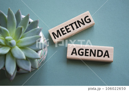 Meeting agenda symbol. Concept word Meeting agenda on wooden blocks. Beautiful grey green background. Business and Meeting agenda concept. Copy space Meeting agenda symbol. Concept word Meeting agenda on wooden blocks. Beautiful grey green background. Business and Meeting agenda concept. Copy space 106022650