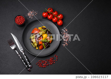 Delicious juicy fresh salad of baked eggplant, tomatoes, zucchini, onions Delicious juicy fresh salad of baked eggplant, tomatoes, zucchini, onions 106023117