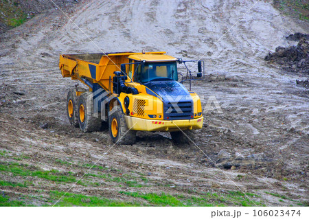 truck works on construction site truck works on construction site 106023474