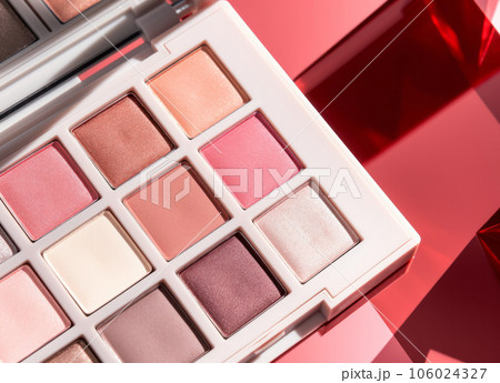 A close-up of pearlescent shimmery palette of pink eyeshadows for creating eye makeup A close-up of pearlescent shimmery palette of pink eyeshadows for creating eye makeup 106024327