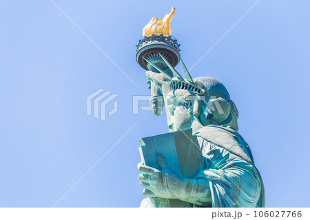 Close view of the Statue of Liberty over blue sky Close view of the Statue of Liberty over blue sky 106027766