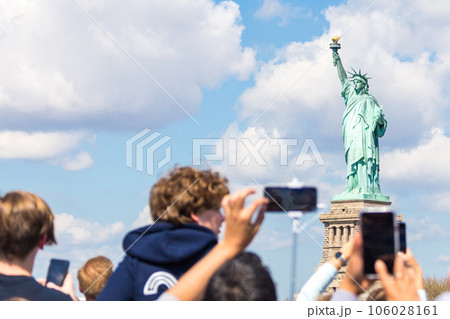 People make photo of the Statue of Liberty, New York City, NY, USA People make photo of the Statue of Liberty, New York City, NY, USA 106028161