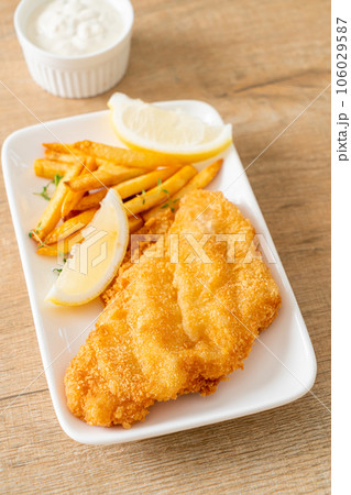 fish and chips - fried fish fillet with potatoes chips fish and chips - fried fish fillet with potatoes chips 106029587