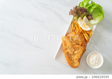fish and chips - fried fish fillet with potatoes chips fish and chips - fried fish fillet with potatoes chips 106029595