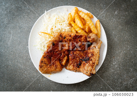grilled spicy barbecue pork steak with french fries grilled spicy barbecue pork steak with french fries 106030023