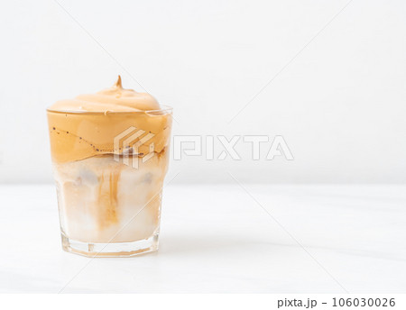 Iced Dalgona Coffee, a trendy fluffy creamy whipped coffee Iced Dalgona Coffee, a trendy fluffy creamy whipped coffee 106030026