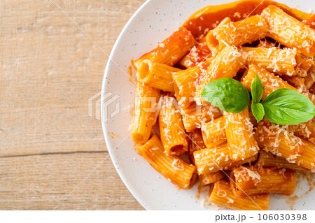 Rigatoni pasta with tomato sauce and cheese Rigatoni pasta with tomato sauce and cheese 106030398