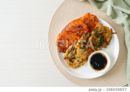 Pajeon or Korean pancake and Korean Kimchi pancake or Kimchijeon on white background Pajeon or Korean pancake and Korean Kimchi pancake or Kimchijeon on white background 106030657