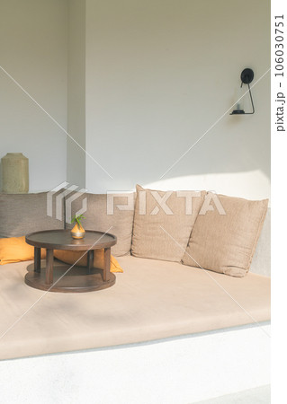 pillows on outdoor patio sofa 106030751
