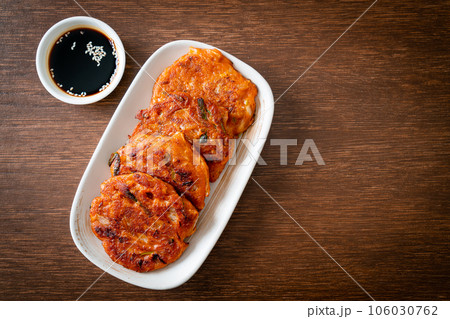 Korean Kimchi pancake or Kimchijeon - Fried Mixed Egg, Kimchi, and Flour 106030762