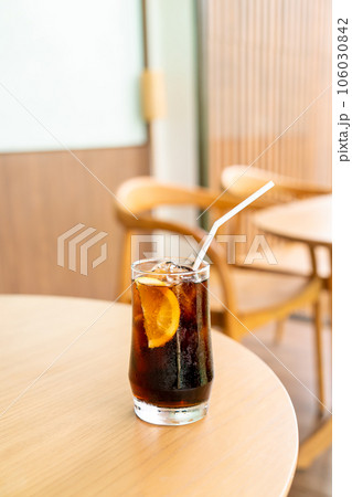 iced cola glass with ice 106030842