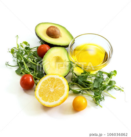 Ingredients of healthy food. Micro green pea sprouts, olive oil, tomato, avocado, lemon. Ketogenic low carbs diet concept. Isolated on a white background Ingredients of healthy food. Micro green pea sprouts, olive oil, tomato, avocado, lemon. Ketogenic low carbs diet concept. Isolated on a white background 106036862