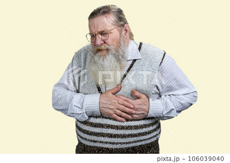 Portrait of aged man touching his chest suffering from heart attack. Isolated on white background. Portrait of aged man touching his chest suffering from heart attack. Isolated on white background. 106039040