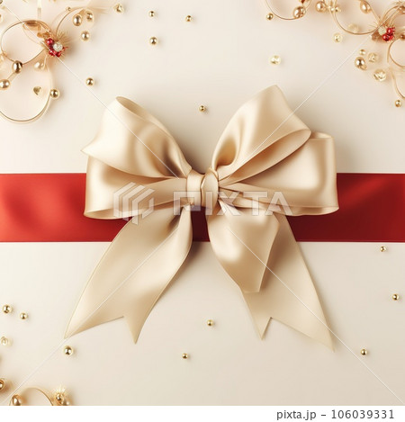 Holiday beige background with gift, red satin bow, ribbon with Copy space 106039331