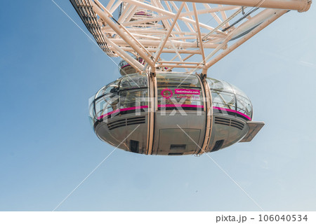 London Eye over Thames River. It is Europe's tallest Ferris wheel and the most popular paid tourist attraction in UK London Eye over Thames River. It is Europe's tallest Ferris wheel and the most popular paid tourist attraction in UK 106040534