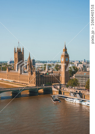 Big Ben, Westminster Bridge on River Thames in London, the UK. English symbol. Lovely puffy clouds, sunny day 106040558