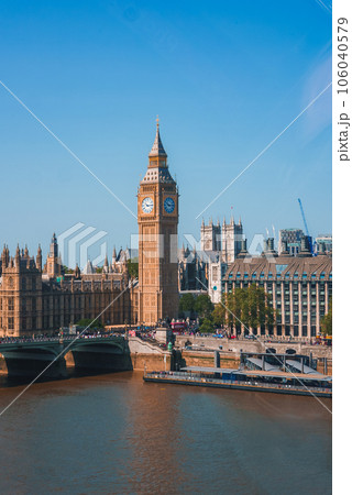 Big Ben, Westminster Bridge on River Thames in London, the UK. English symbol. Lovely puffy clouds, sunny day 106040579