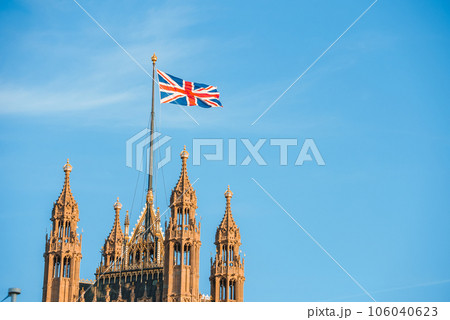 Single Union Jack flag waving in front of Big Ben at the Houses of Parliament in London, UK on a clear sunny day Single Union Jack flag waving in front of Big Ben at the Houses of Parliament in London, UK on a clear sunny day 106040623