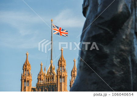 Single Union Jack flag waving in front of Big Ben at the Houses of Parliament in London, UK on a clear sunny day Single Union Jack flag waving in front of Big Ben at the Houses of Parliament in London, UK on a clear sunny day 106040654