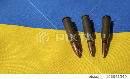 Several bullets are on the Ukrainian flag. Several bullets are on the Ukrainian flag. 106041549
