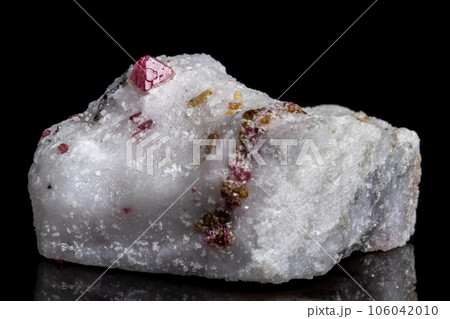 Macro mineral stone Spinel on a black background Macro mineral stone Spinel on a black background 106042010