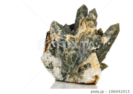 Macro mineral stone Quartz Hedenbergite Prase on ilvite on a white background Macro mineral stone Quartz Hedenbergite Prase on ilvite on a white background 106042013