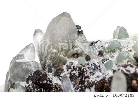 Macro mineral stone Drusus quartz with sphalerite in the rock a white background Macro mineral stone Drusus quartz with sphalerite in the rock a white background 106042285