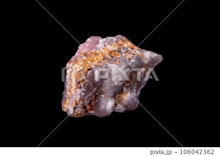 Macro pink Smithsonite mineral stone on microcline on black background 106042362