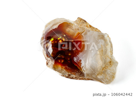 Macro mineral stone fiery Agate on a white background Macro mineral stone fiery Agate on a white background 106042442