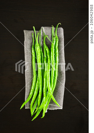 chili pepper on a black background. 106042988