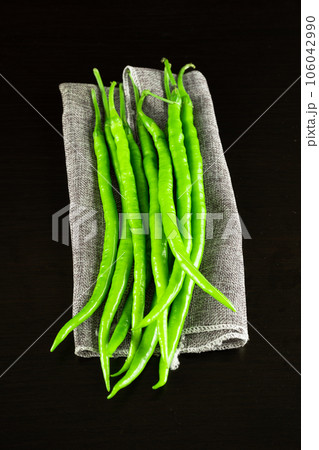 chili pepper on a black background. 106042990