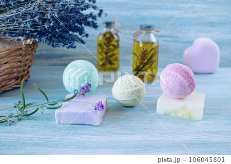 Lavender soap, fragrance oil, foam bombs and fresh lavender flowers on a wooden background, bath products Lavender soap, fragrance oil, foam bombs and fresh lavender flowers on a wooden background, bath products 106045801