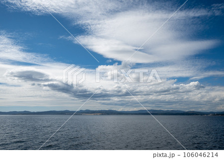 Summer cloudscape over Victoria, British Columbia and Juan de Fuca Strait. 106046214