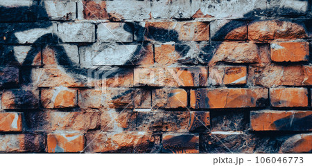 Abstract colorful fragment of graffiti paintings on old brick wall. 106046773