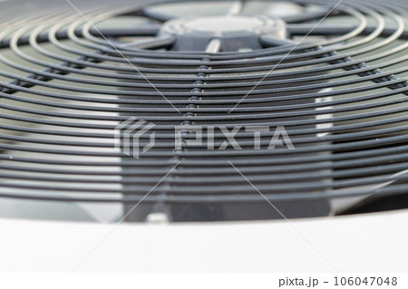 Close up side view of out side air conditioner fan 106047048