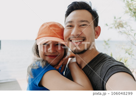Funny and cheerful selfie portrait of couple lover. 106048299