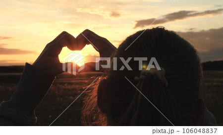 silhouette girl heart fingers romance journey sunset, happy girl dream sun sky, heart golden sky, silhouette happy woman park, sunset sun light hand heart fingers, travel vacation, portrait happy girl silhouette girl heart fingers romance journey sunset, happy girl dream sun sky, heart golden sky, silhouette happy woman park, sunset sun light hand heart fingers, travel vacation, portrait happy girl 106048837