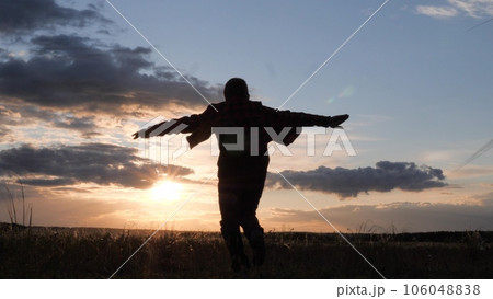 American boy runs across field with his hands up, childhood dream airplane pilot, happy child run sunset, child boy superhero, child dreams flying, wants become astronaut, become airplane pilot American boy runs across field with his hands up, childhood dream airplane pilot, happy child run sunset, child boy superhero, child dreams flying, wants become astronaut, become airplane pilot 106048838
