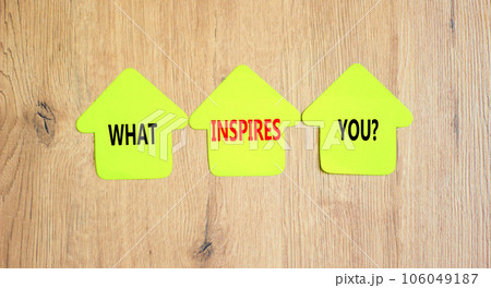 What inspires you symbol. Concept words What inspires you on beautiful yellow paper house. Beautiful wooden background. Business motivational what inspires you concept. Copy space. 106049187