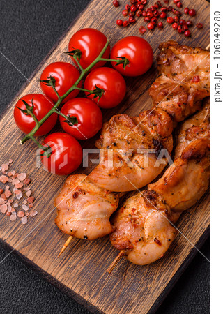 Delicious fresh, juicy chicken or pork kebab on skewers with salt and spices 106049280