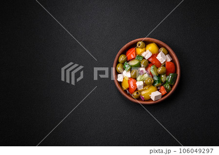 Delicious fresh, juicy Greek salad with feta cheese, olives, tomatoes, cucumber Delicious fresh, juicy Greek salad with feta cheese, olives, tomatoes, cucumber 106049297